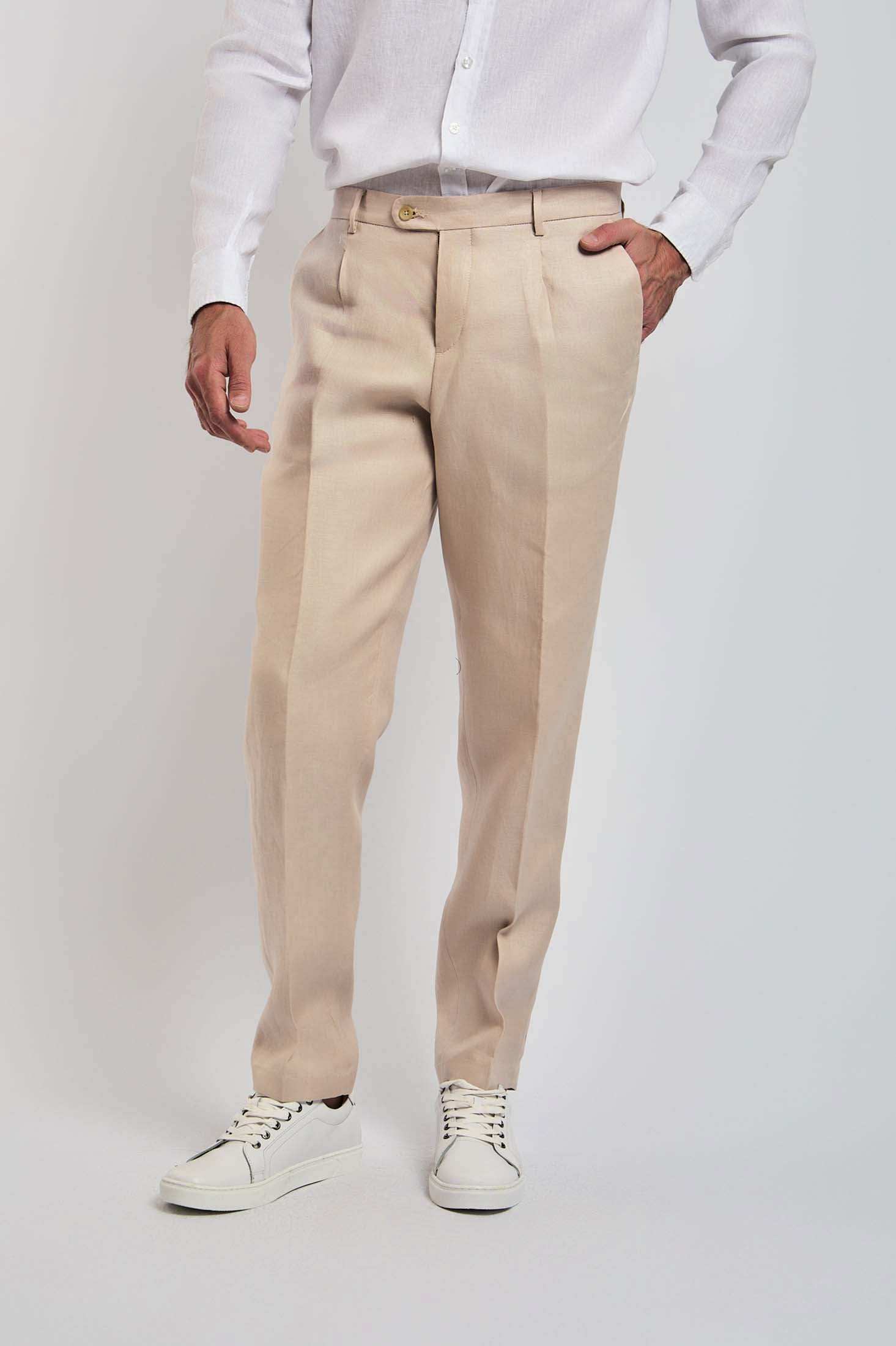Dalydress men's beige trousers paired with white shirt and white sneakers